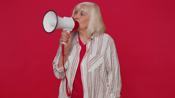 Smiling Senior Woman Talking with Megaphone Proclaiming News Loudly Announcing Sale Advertisement