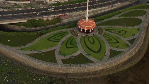 Park designed with Lotus flower pattern, Saigon River, traffic bridge, canal and main road drone sho