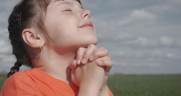 Girl Praying in Nature