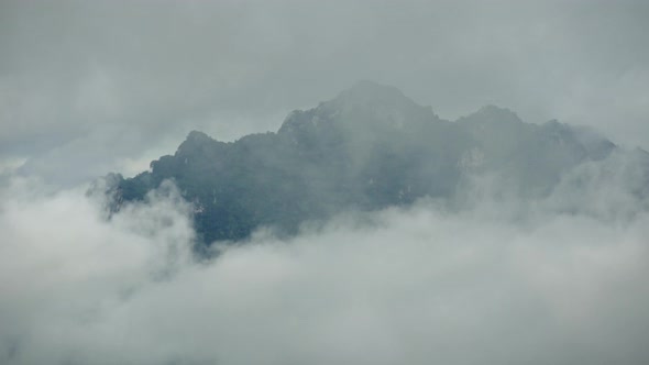 Beautiful Landscape in the morning time during sunrise with fog above the mountain, alt