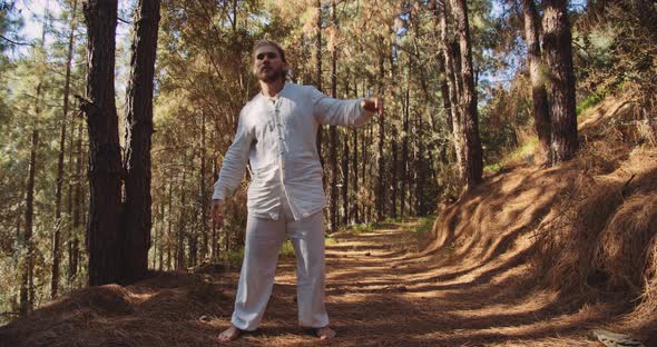 Man Dancing In Trance In Forest