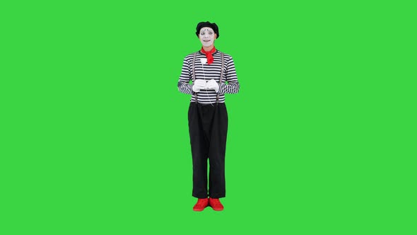 Mime Artist Holding Paper Rose Flower on a Green Screen Chroma Key