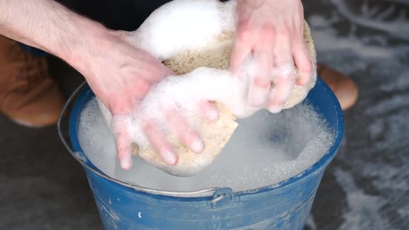 White Foam in a Blue Bucket