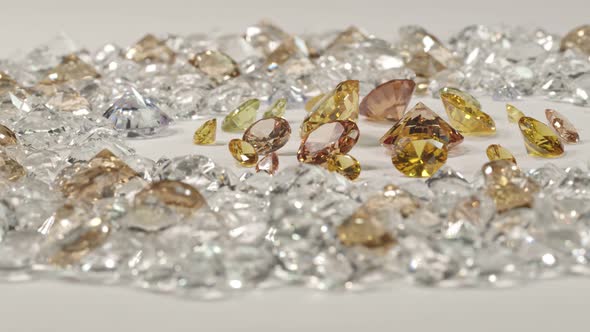 A Pile Of Golden Diamonds Placed On A White Background