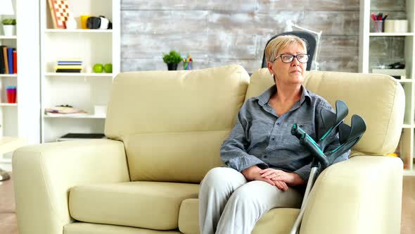 Male Nurse Talking with Old Woman Suffering of Parkinson