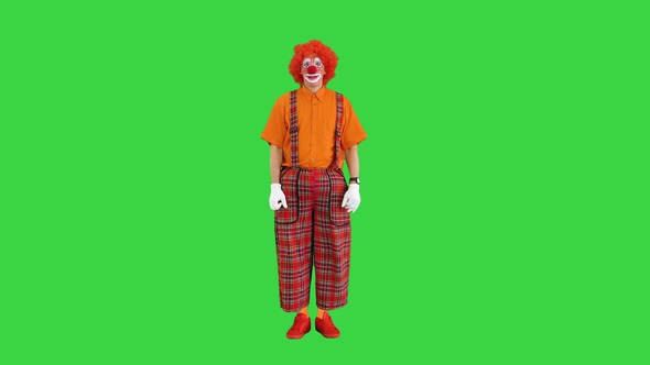 Funny Clown Looking at His Watch and Running Away Being Late on a Green Screen Chroma Key