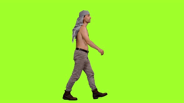 Tourist in Arabic Scarf Walks on Green Background, Chroma Key