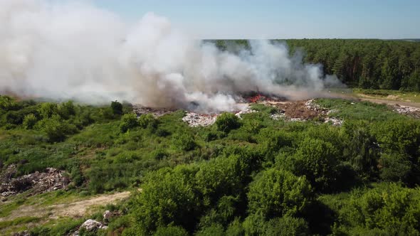 Flying over burning garbage dump