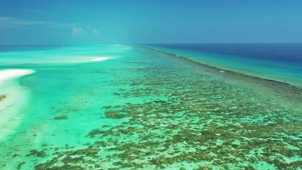 Aerial drone view tourism of paradise bay beach break by blue lagoon with white sand background of a