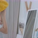Lovely Asian girl trying the new hat in front of the mirror. - VideoHive Item for Sale