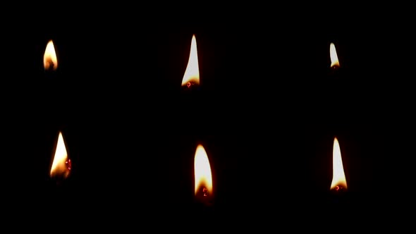 Six realistic candle flame isolated against a dark (alpha) background.