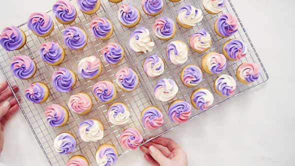 Flat lay. Baking small cupcakes with unicorn theme.