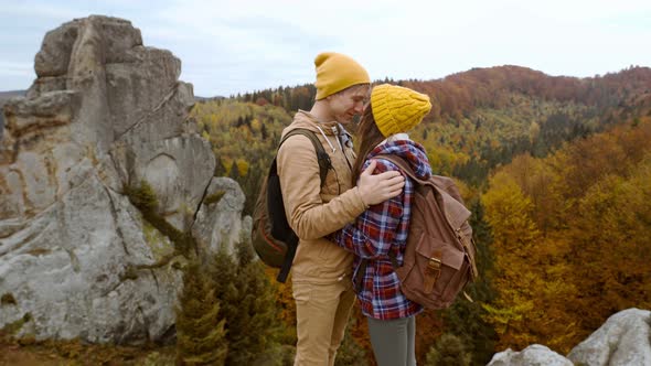 Couple Hikers Hipsters Stands on Autumn Landscape Background with Cliffs in National Park Tustan