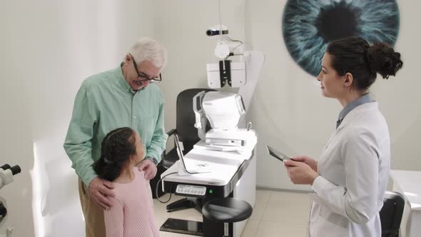 Cheerful Patients In Optometrist Office