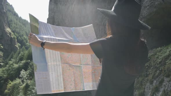 Women with Touristic Map in Sunny Day Travel Concept in Nature