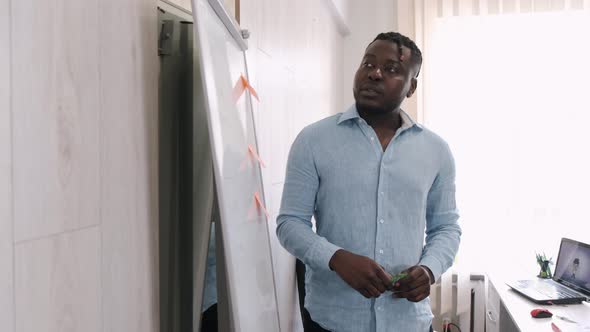 African American Teacher Teaching English Two Primary School Girls