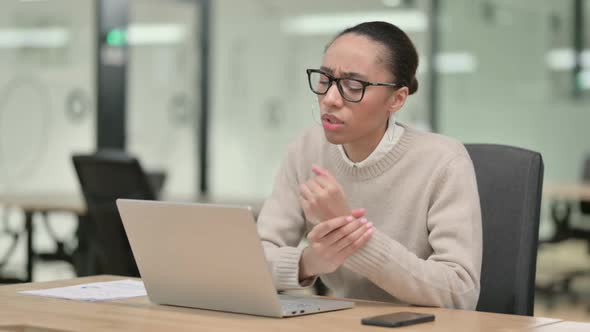 Creative African Woman with Laptop Having Wrist Pain