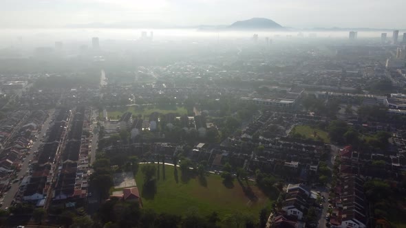 Aerial view mist morning fog at residential area