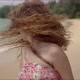 Confident Woman with Waving Hairs Walking on Sandy Beach and Looking at Camera - VideoHive Item for Sale