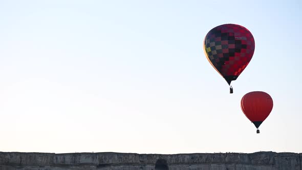 Beautiful Rocky Landscape of Crimea with Colorful Hotair Balloons Balloons Flying on Sunset HDR Time