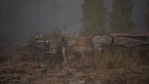 An Old Wood Fence with a Country Field Behind It alt