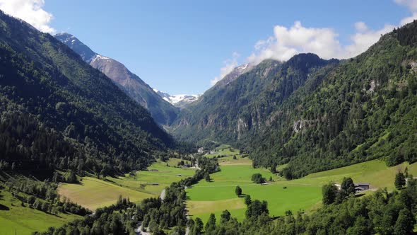 Green Valley Amidst The Alpine Mountain Range Around The Klammsee Lake, Kaprun, Salzburg, Austria. a