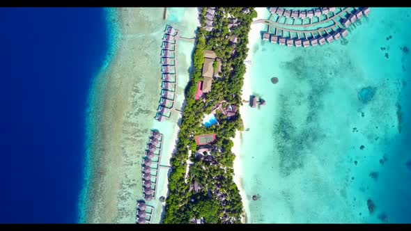 Aerial above seascape of paradise resort beach voyage by blue lagoon with white sandy background of 