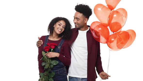 Slow Motion Young African American Man Surprise His Girlfriend with Rose and Heart Balloon on