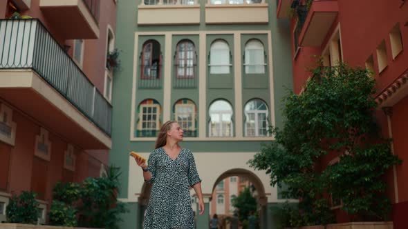 Beautiful Young Girl Walking Around the Resort Town