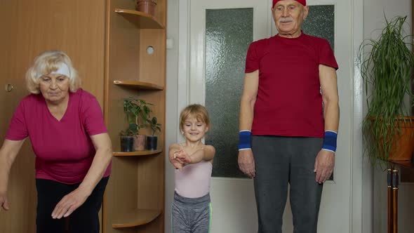 Old Grandmother Grandfather with Child Girl Kid Doing Workout Exercises Training Fitness at Home