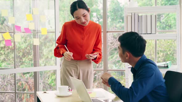 Business People Work on Project Planning Board