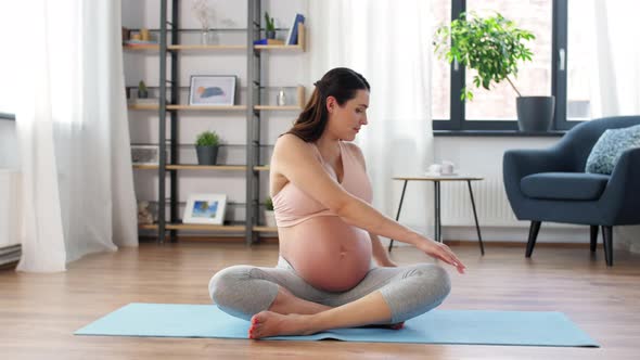 Happy Pregnant Woman Doing Sports at Home