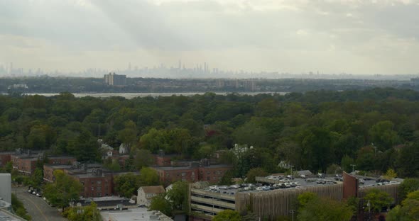 Lowering Aerial of Great Neck and New York City Skyline Seen from a Distance