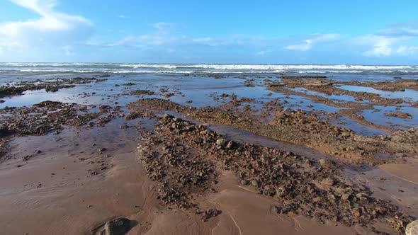 Moving over Rocky Beach in Sunny Summer Morocco Natural Scenery