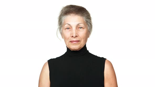 Picture of Adult Woman with White Tied Hair Looking at Camera Smiling Nodding Positively Over White