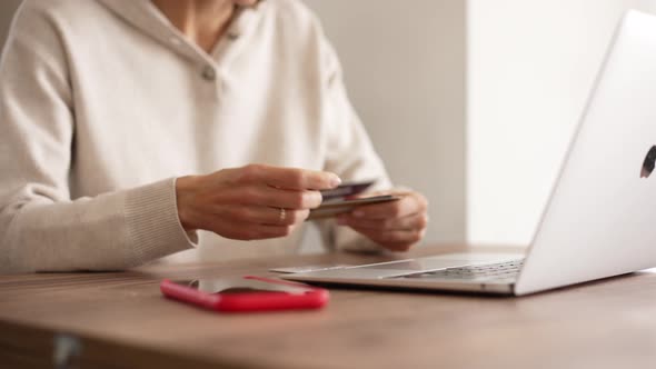 Upset Young Woman Using Online Banking Service Problem with Blocked Credit Card Using Laptop