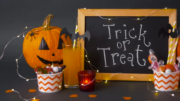 Pumpkins, Candies and Halloween Decorations