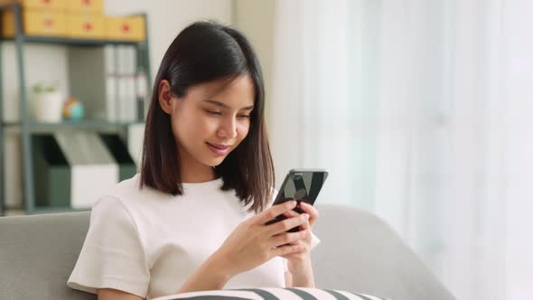 woman using smartphone, During leisure time.