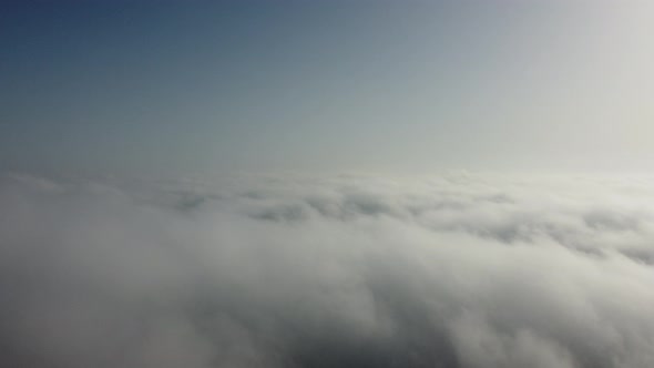 High Above the Thick Fog Like Beautiful Ocean of Clouds at Sunrise