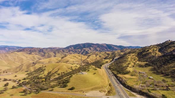 Highway and Hilly Rural Landscape. Kern County. California, USA. Aerial View