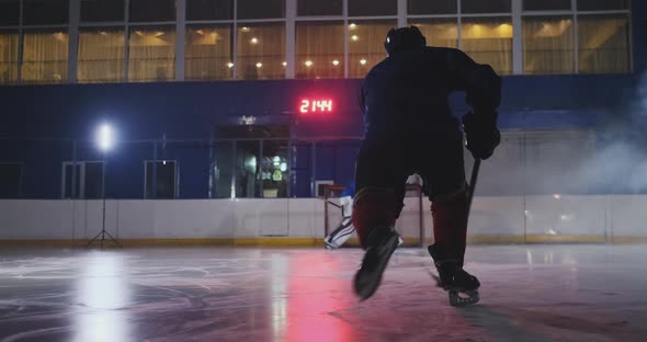 Professional Hockey Player Attacks the Gate and Strikes, but the Goalkeeper Beats the Puck