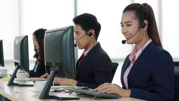 Business People Wearing Headset Working in Office