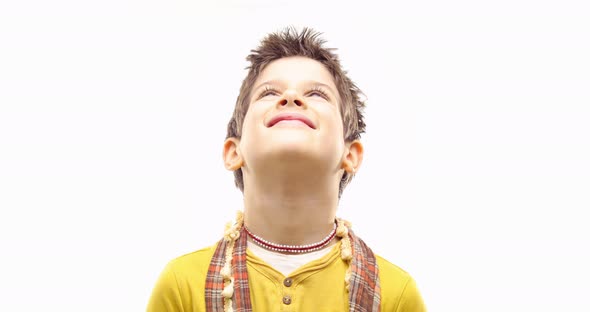 Beautiful Happy Fun Young Child Blond Smarty Boy Smiling Making Faces and Looking Left and Right Up