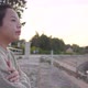 Asian woman sitting and getting good weather by the river - VideoHive Item for Sale