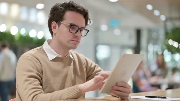 Man Using Tablet in Office