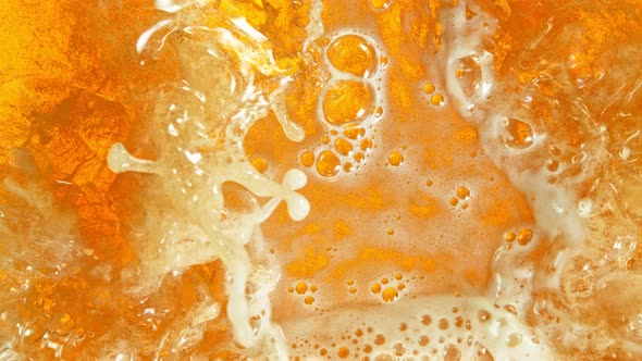 Super Slow Motion Shot of Rippling Fresh Beer Wave From Top Shot at 1000Fps