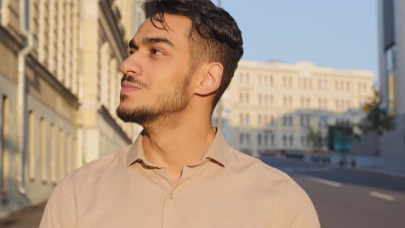Portrait Calm Hispanic Arabic Businessman Walking in City Building Background