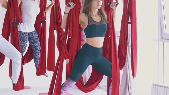 Strong Ladies Group Practices Modern Antigravity Yoga