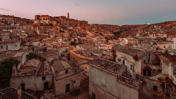 Sassi of Matera from sunset to night with illumination of the houses, Timelapse 4k