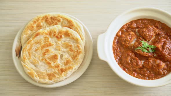 chicken tikka masala spicy curry meat food with roti or naan bread - Indian food style